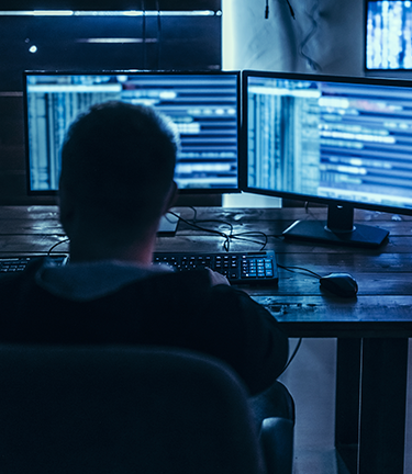 Cyber security specialist analyzes employee’s information to protect against identity fraud